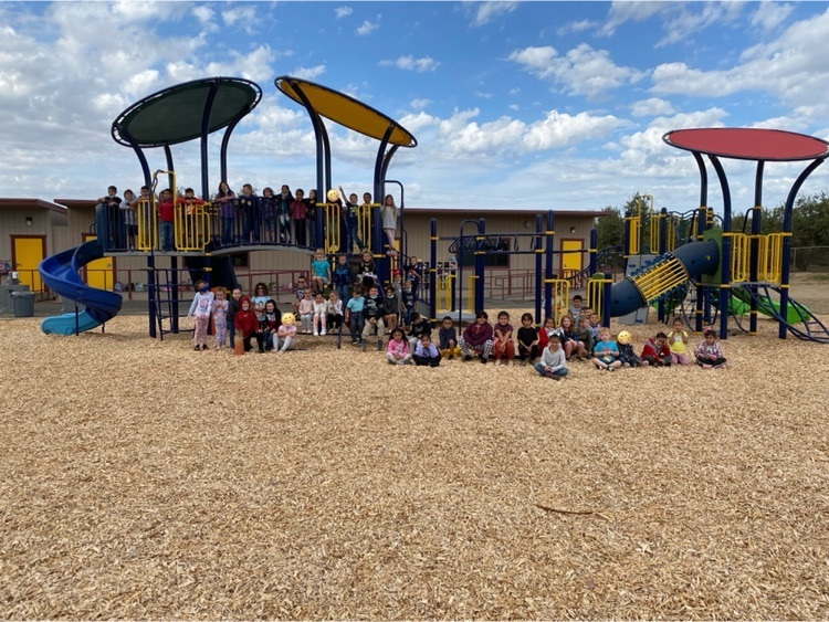 kindergarten, 1st and 2nd grade in front of the new playground