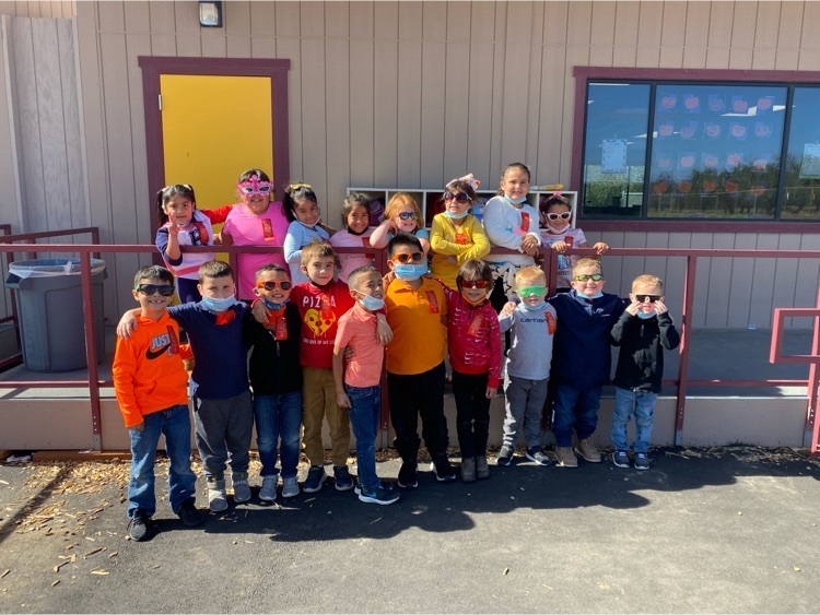 kindergarten class wearing bright colors and sunglasses 