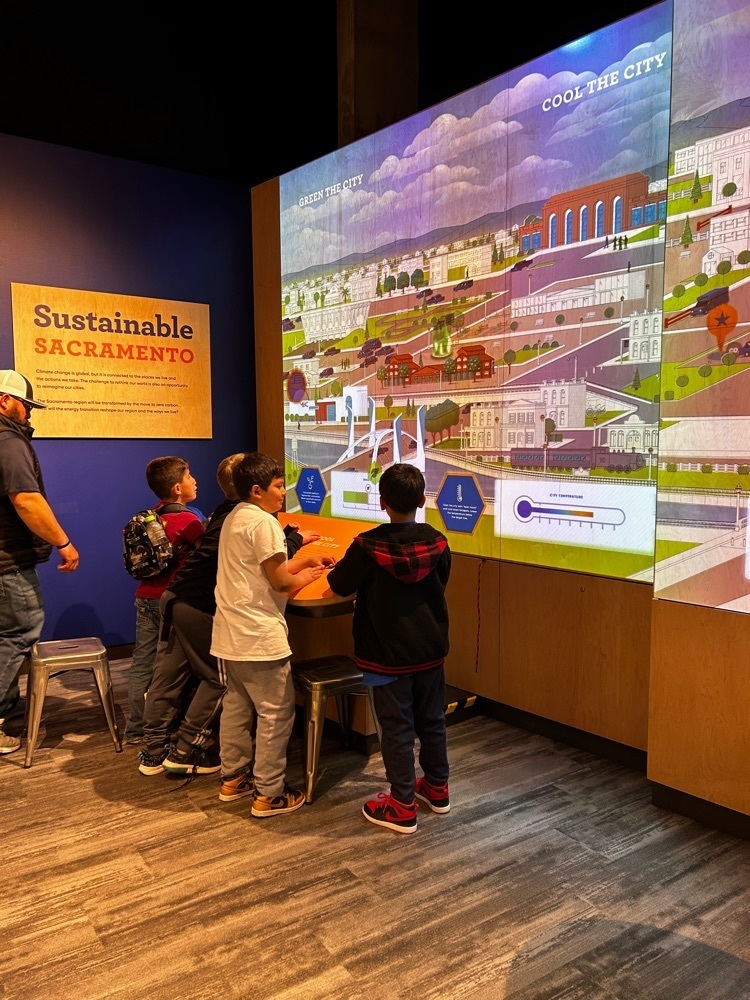3rd grade students with city simulator.